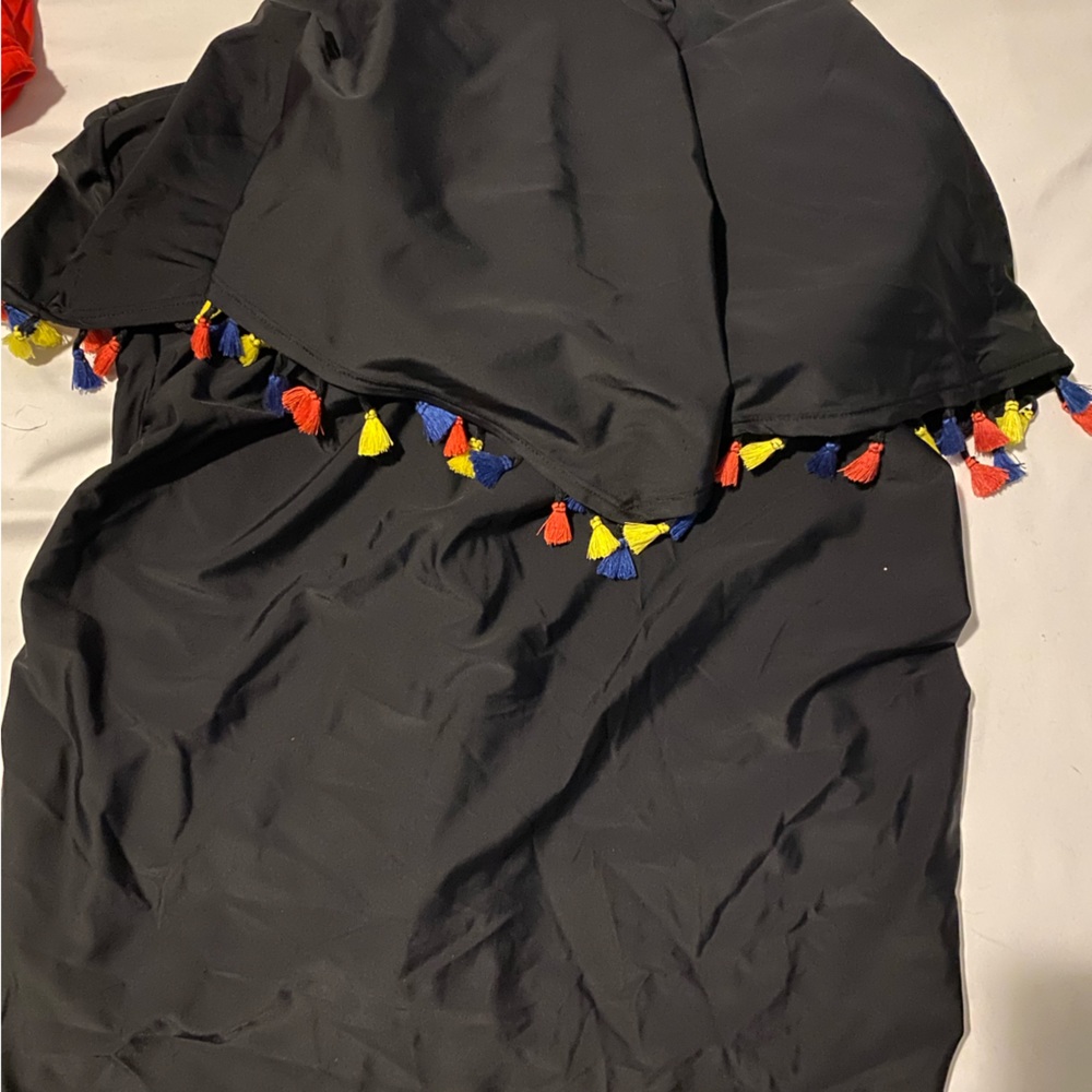 Very cute black swim top with tassels.